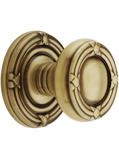 Ribbon and Reed Door Set With Matching Knobs in Antique Brass.